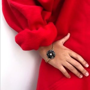 Gold tone and black flower bracelet